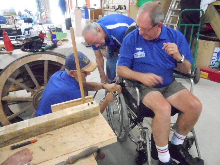 Repairing a wheelchair at Warradale Men's Shed