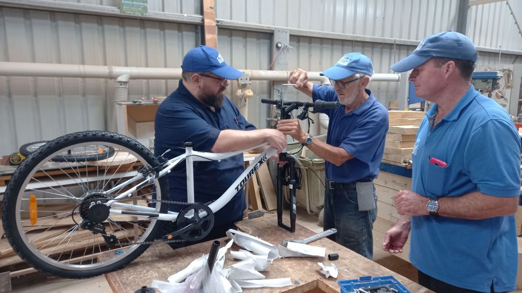 Assembling a bicycle at Warradale Men's Shed